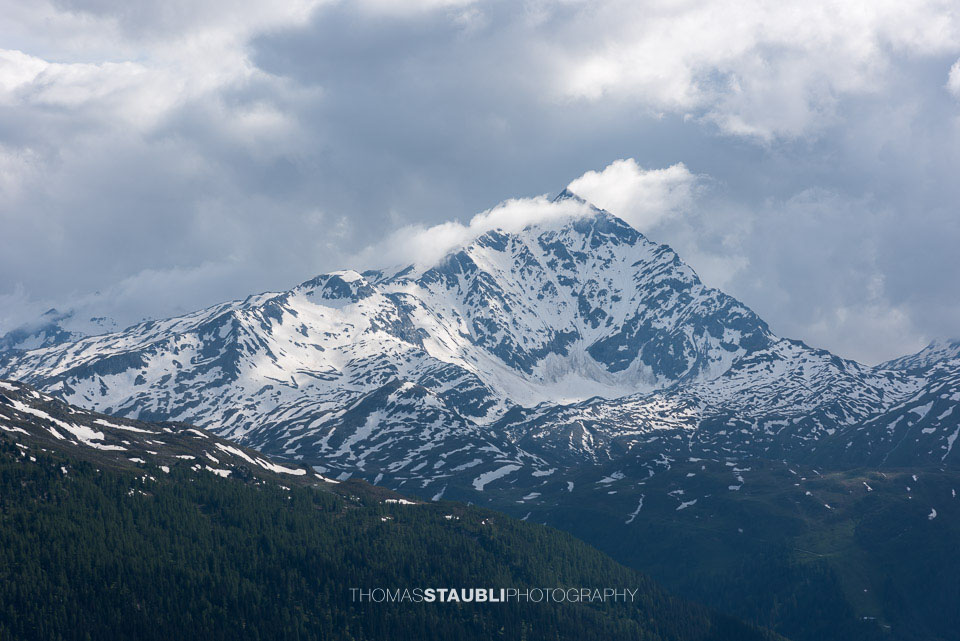 Wolken und Sonne am Pizzo Tambo